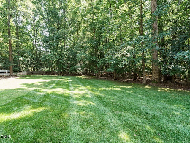 8504 Carlton Oaks Dr, Wake Forest, NC 27587 - view of yard featuring a forest view