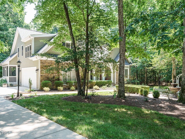 8504 Carlton Oaks Dr, Wake Forest, NC 27587 - view of front of house with a garage, concrete driveway, and a front lawn