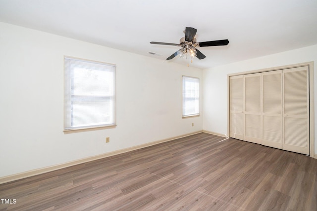 1505 Clermont Rd Unit 15, Durham, NC 27713 - unfurnished bedroom with wood finished floors, a closet, baseboards, and a ceiling fan