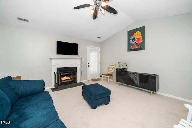 213 Bracken Ct, Raleigh, NC 27615 - carpeted living room featuring a ceiling fan, a fireplace with flush hearth, and lofted ceiling