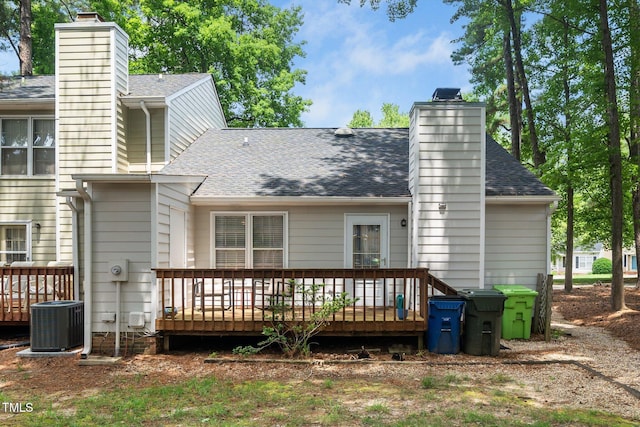 213 Bracken Ct, Raleigh, NC 27615 - rear view of property with a chimney, a deck, and roof with shingles