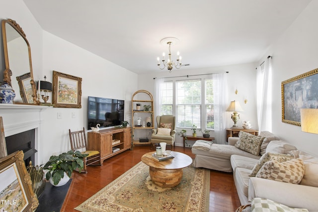 818 Bryant St, Raleigh, NC 27603 - living area featuring a chandelier, dark wood-type flooring, and a fireplace with flush hearth