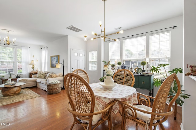 818 Bryant St, Raleigh, NC 27603 - dining space featuring a chandelier and wood finished floors
