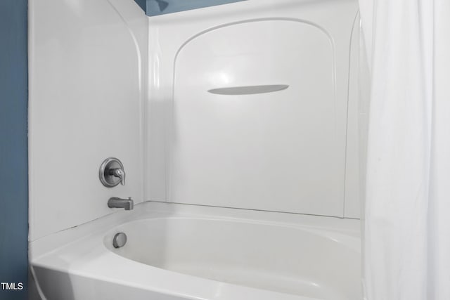 818 Bryant St, Raleigh, NC 27603 - bathroom featuring shower / tub combo with curtain