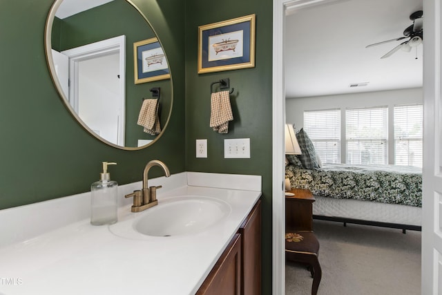 818 Bryant St, Raleigh, NC 27603 - bathroom featuring a ceiling fan, vanity, and ensuite bathroom