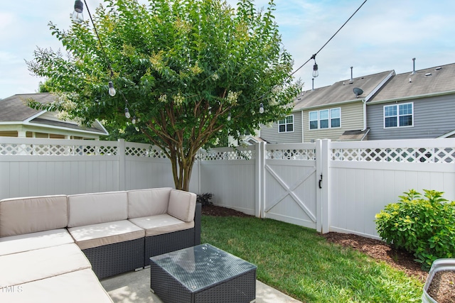 818 Bryant St, Raleigh, NC 27603 - fenced backyard with an outdoor hangout area, a patio area, and a gate