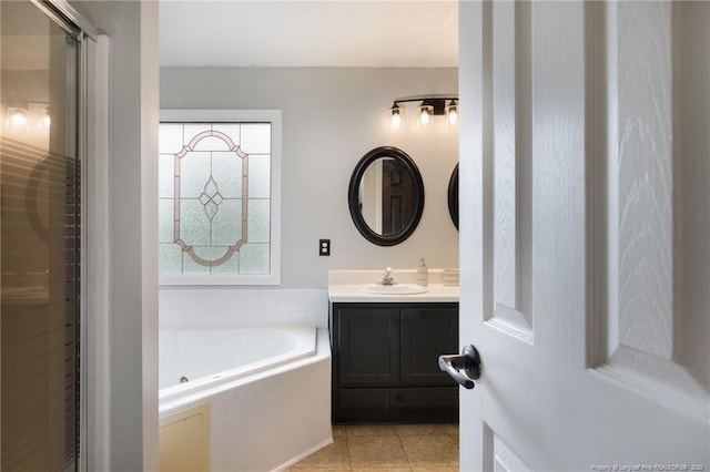 6529 Jacobs Creek Cir, Fayetteville, NC 28306 - bathroom featuring vanity, a tub with jets, tile patterned flooring, and a stall shower