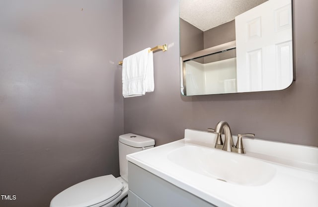 2600 Dwight Pl, Raleigh, NC 27610 - full bath with vanity, a textured ceiling, and a shower