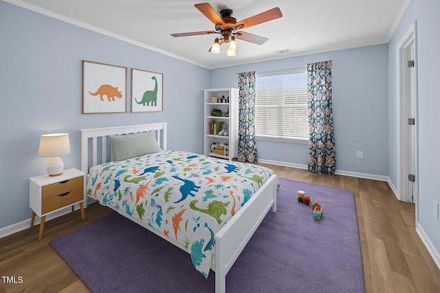 5561 Roan Mountain Pl, Raleigh, NC 27613 - bedroom featuring wood finished floors, ornamental molding, and a ceiling fan