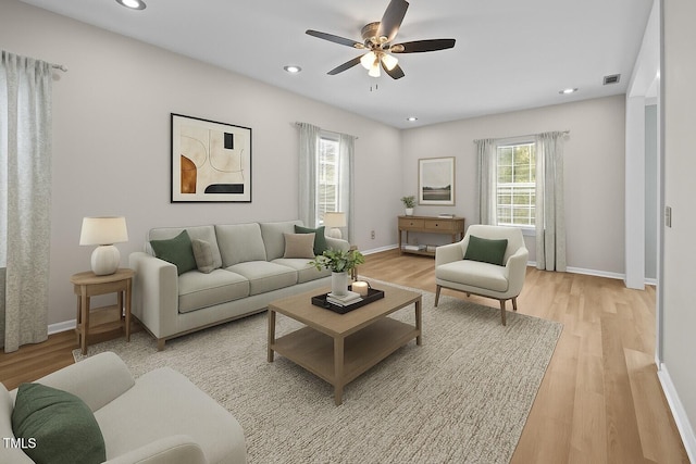 5561 Roan Mountain Pl, Raleigh, NC 27613 - living area with light wood-style floors, a ceiling fan, and recessed lighting
