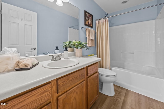 5561 Roan Mountain Pl, Raleigh, NC 27613 - bathroom with vanity, shower / bath combo with shower curtain, and wood finished floors