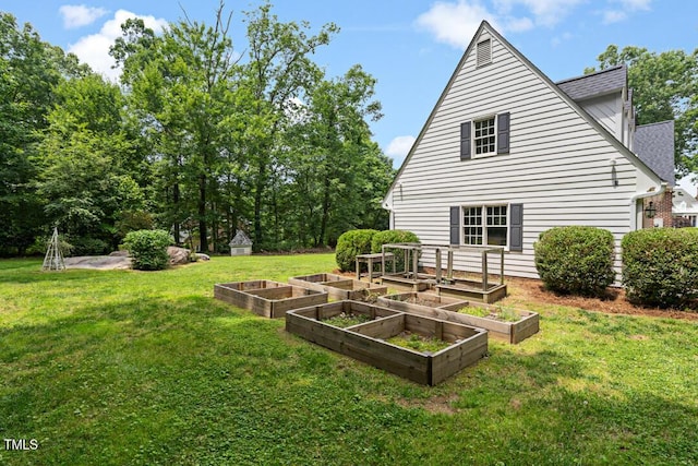 305 Lochridge Dr, Roxboro, NC 27573 - view of green lawn with a vegetable garden