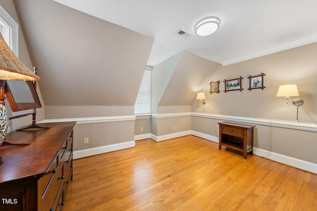 305 Lochridge Dr, Roxboro, NC 27573 - additional living space featuring light wood-style flooring and vaulted ceiling