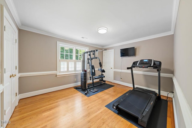 305 Lochridge Dr, Roxboro, NC 27573 - exercise area featuring wood finished floors and ornamental molding