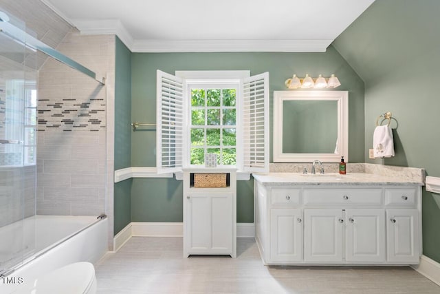 305 Lochridge Dr, Roxboro, NC 27573 - bathroom featuring vanity, bath / shower combo with glass door, crown molding, and wood finished floors