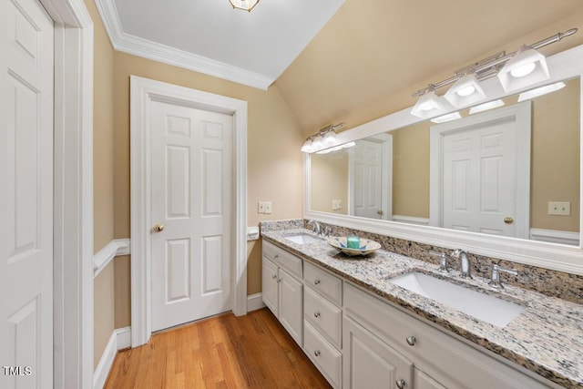 305 Lochridge Dr, Roxboro, NC 27573 - full bath with double vanity, wood finished floors, lofted ceiling, and crown molding