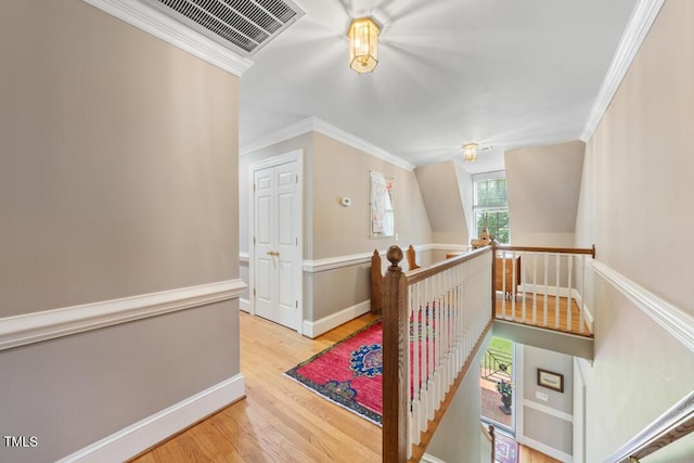 305 Lochridge Dr, Roxboro, NC 27573 - hallway with an upstairs landing, crown molding, and wood finished floors