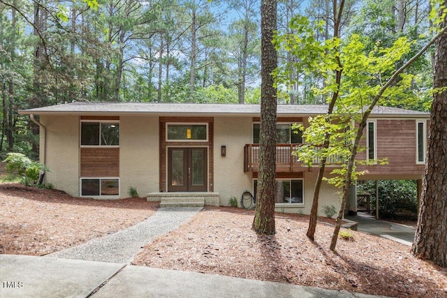 6609 Hunters Ln, Durham, NC 27713 - view of front of home featuring brick siding and french doors