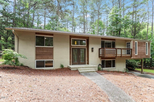 6609 Hunters Ln, Durham, NC 27713 - view of front of house with brick siding and french doors
