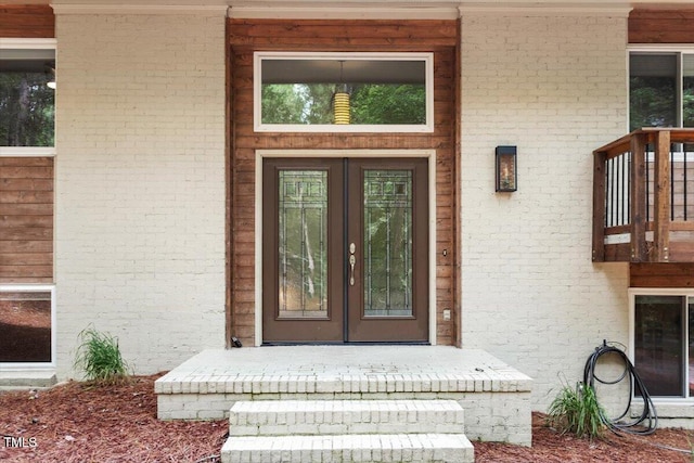 6609 Hunters Ln, Durham, NC 27713 - doorway to property with french doors and brick siding