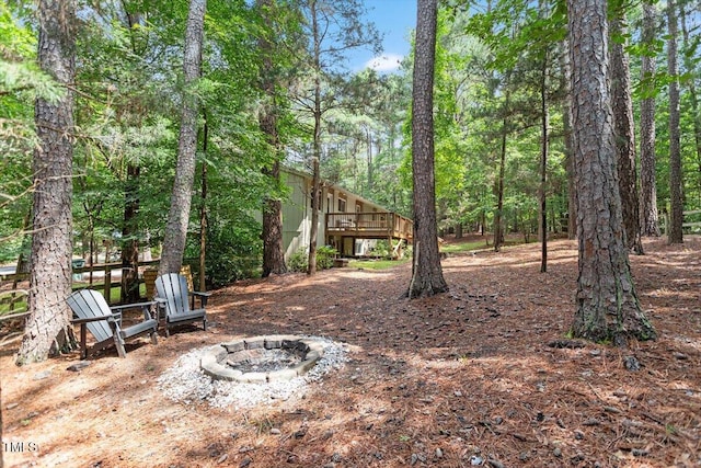 6609 Hunters Ln, Durham, NC 27713 - view of yard with an outdoor fire pit and a wooden deck
