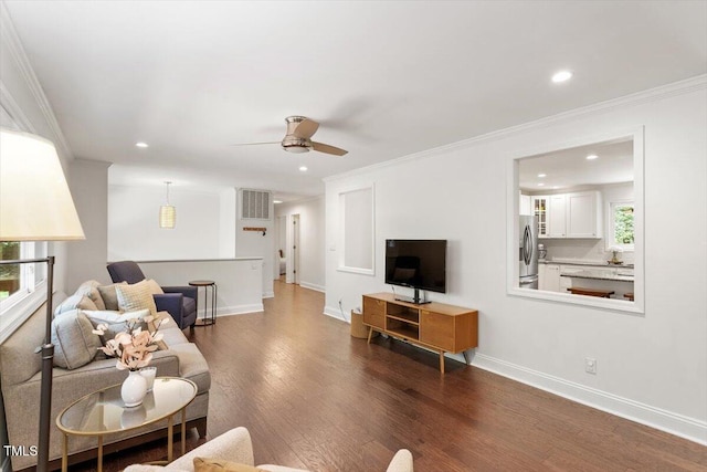 6609 Hunters Ln, Durham, NC 27713 - living area featuring dark wood finished floors, ceiling fan, recessed lighting, and crown molding