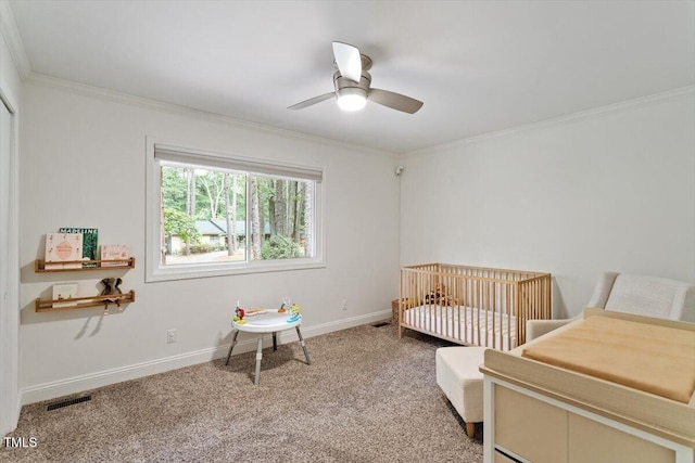 6609 Hunters Ln, Durham, NC 27713 - carpeted bedroom with ornamental molding, a crib, and ceiling fan