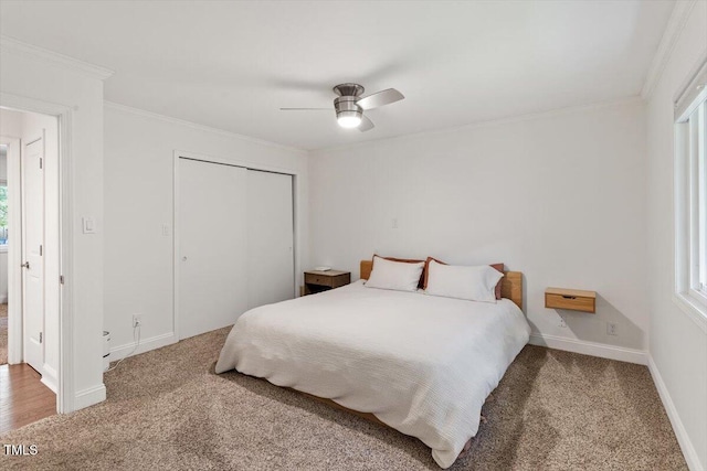 6609 Hunters Ln, Durham, NC 27713 - bedroom with carpet floors, crown molding, a closet, and ceiling fan