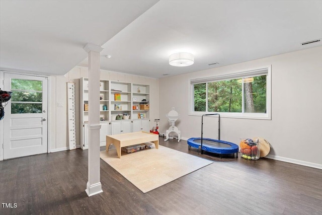 6609 Hunters Ln, Durham, NC 27713 - playroom featuring dark wood-style floors and ornate columns