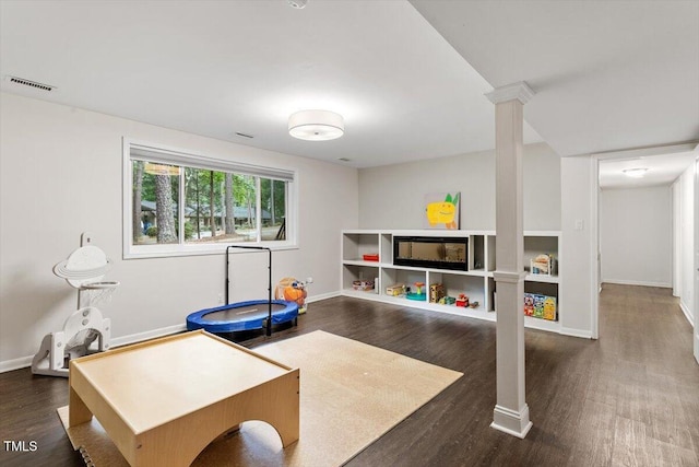 6609 Hunters Ln, Durham, NC 27713 - exercise area featuring dark wood-style floors and decorative columns