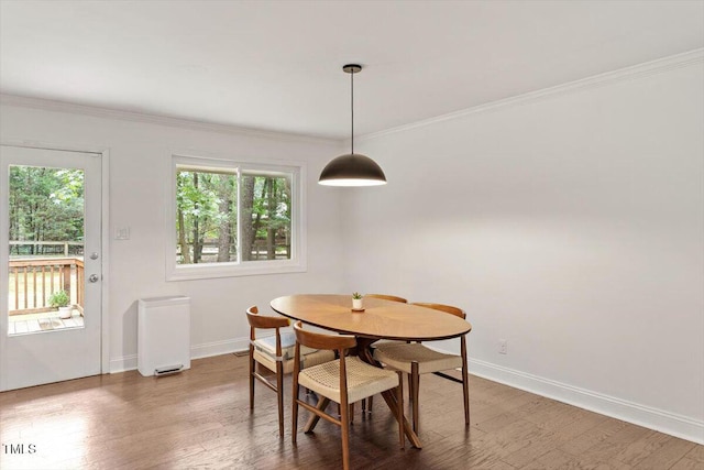 6609 Hunters Ln, Durham, NC 27713 - dining room featuring wood finished floors and ornamental molding