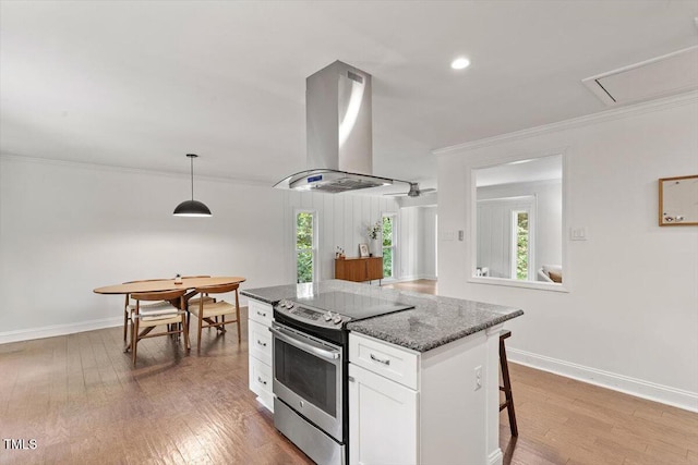 6609 Hunters Ln, Durham, NC 27713 - kitchen featuring stainless steel range with electric stovetop, island range hood, white cabinets, light wood-style flooring, and ornamental molding