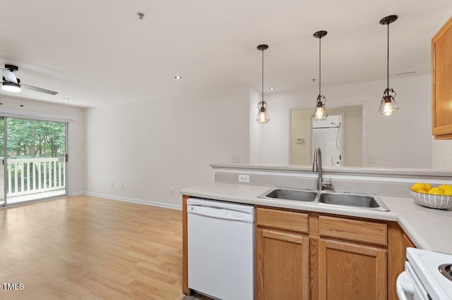 1851 Trailwood Heights Ln, Raleigh, NC 27603 - kitchen featuring white appliances, light countertops, ceiling fan, pendant lighting, and light wood-style flooring