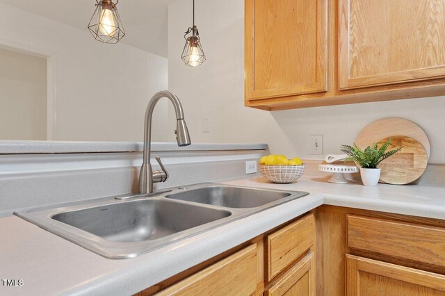 1851 Trailwood Heights Ln, Raleigh, NC 27603 - kitchen featuring light countertops and hanging light fixtures