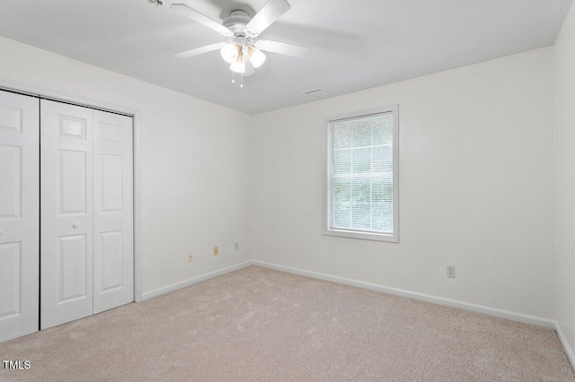 1851 Trailwood Heights Ln, Raleigh, NC 27603 - unfurnished bedroom with carpet, a closet, and a ceiling fan