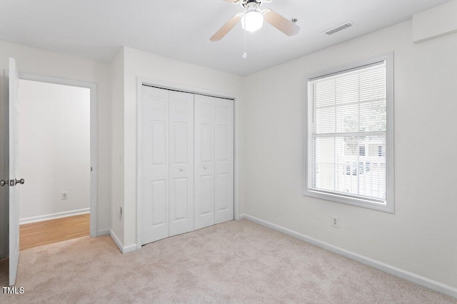 1851 Trailwood Heights Ln, Raleigh, NC 27603 - unfurnished bedroom featuring carpet, a closet, and ceiling fan
