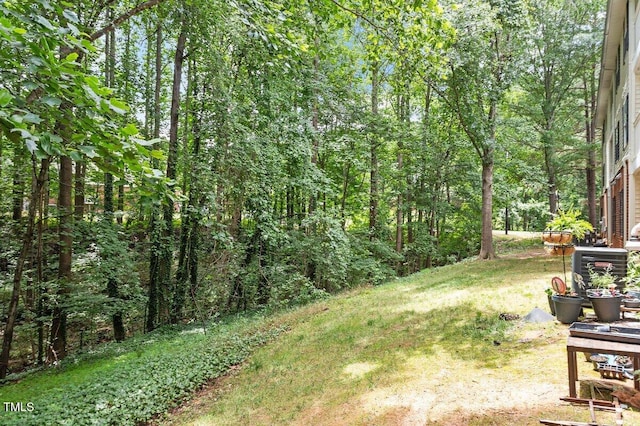 1851 Trailwood Heights Ln, Raleigh, NC 27603 - view of grassy yard featuring a wooded view