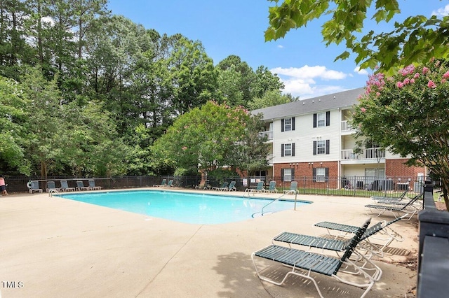 1851 Trailwood Heights Ln, Raleigh, NC 27603 - community pool featuring a patio area
