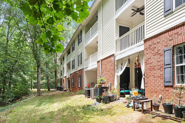 1851 Trailwood Heights Ln, Raleigh, NC 27603 - view of side of property featuring brick siding, ceiling fan, and a balcony