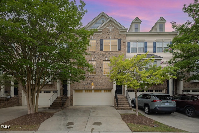 404 Panorama Park Pl, Cary, NC 27519 - multi unit property featuring concrete driveway, stairs, an attached garage, and brick siding