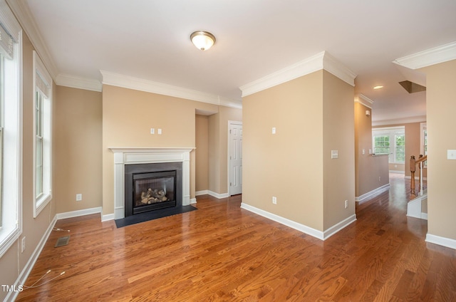 404 Panorama Park Pl, Cary, NC 27519 - unfurnished living room with ornamental molding, a fireplace with flush hearth, and wood finished floors