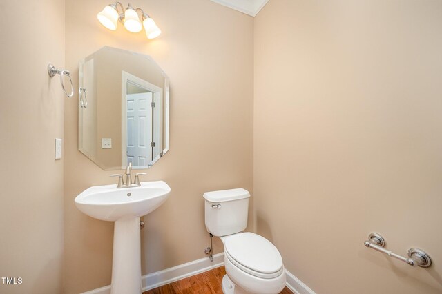 404 Panorama Park Pl, Cary, NC 27519 - half bathroom featuring toilet and wood finished floors