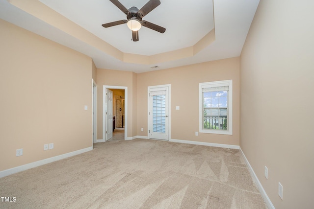 404 Panorama Park Pl, Cary, NC 27519 - unfurnished bedroom with carpet flooring, a tray ceiling, and ceiling fan