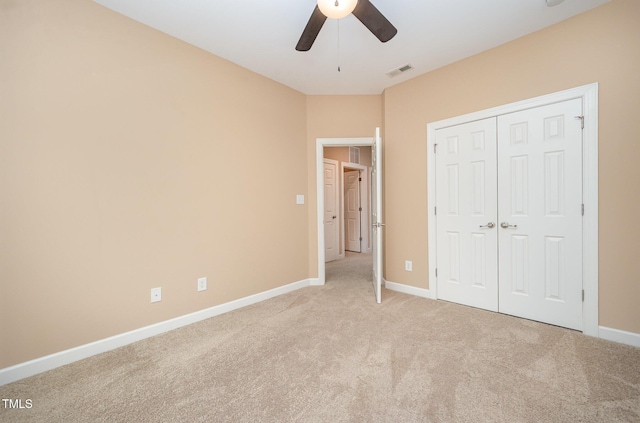 404 Panorama Park Pl, Cary, NC 27519 - unfurnished bedroom featuring light carpet, a closet, and a ceiling fan