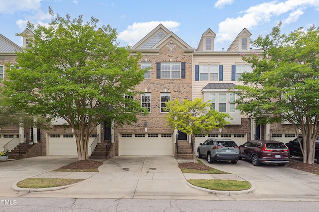 404 Panorama Park Pl, Cary, NC 27519 - multi unit property featuring stairs, concrete driveway, brick siding, and an attached garage