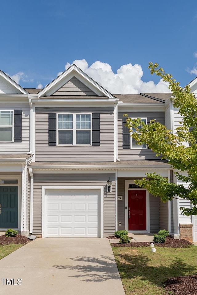 227 Liam St, Clayton, NC 27520 - multi unit property featuring a garage and concrete driveway