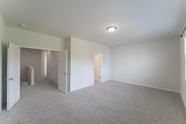 227 Liam St, Clayton, NC 27520 - empty room with light colored carpet, baseboards, and a smoke detector