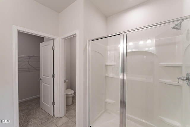 227 Liam St, Clayton, NC 27520 - bathroom featuring a stall shower, toilet, and a walk in closet