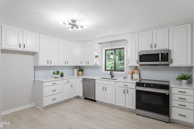 2905 Scuppernong Ln, Durham, NC 27703 - kitchen with stainless steel appliances, light countertops, and backsplash