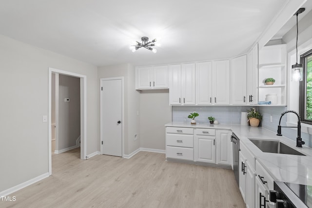 2905 Scuppernong Ln, Durham, NC 27703 - kitchen with light wood-style flooring, dishwasher, white cabinetry, decorative backsplash, and open shelves
